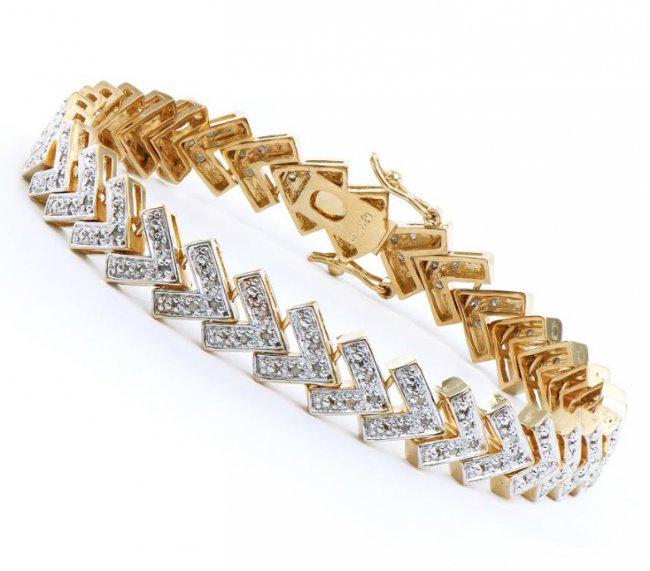 1.23 CT Diamond Designer Bracelet MSRP $2,340: 135 Single cut diamonds Color: I & Clarity: SI2 No treatment. 11.89 grams of Base Metal layered with 18K yellow Gold. Length is 7 1/2 inches. The width is 1/4 inches. This lovely bracelet comes in a f