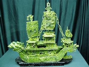 24" GREEN JADE DRAGON BOAT: This jade boat is made from natural green jade. It consists of boat body, chains, sails, flag, anchor, rudder, and wooden base. Very detailed carving. LENGTH: 24", HEIGHT: 24", WIDTH: 6".