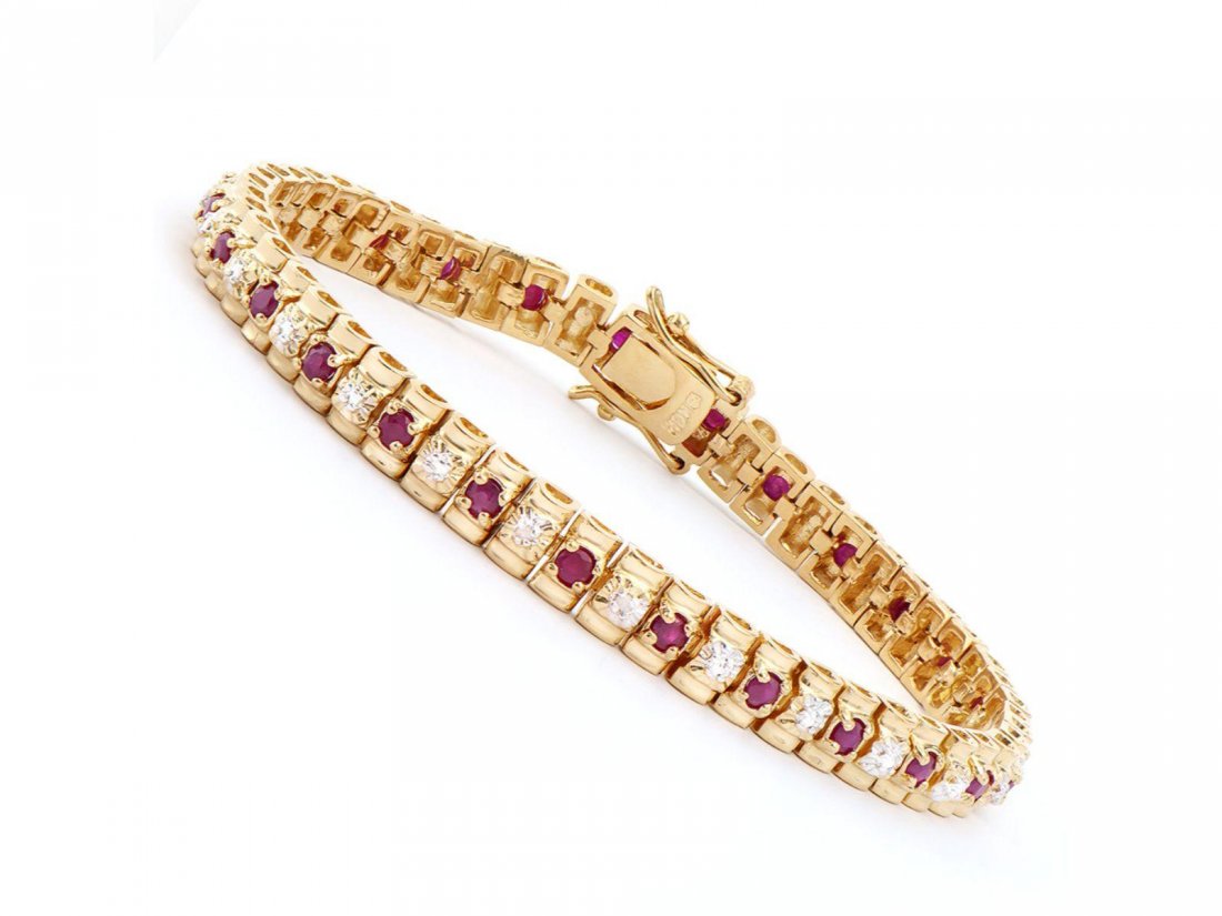 2.55 Cts Ruby & Diamond Designer Bracelet $1,310: One Plated 18KT Yellow Gold 2.50ctw Ruby and Diamond Bracelet. (27) Rubies with a total weight of 2.50cts. Diamonds with a total weight of 0.015cts with a color of I-J and clarity of I-3. Total weight