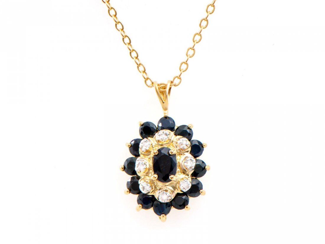 2.63 Ct Black Sapphire & Diamond Designer Necklace $995: One Plated 18KT Yellow Gold 2.60ctw Black Sapphire and Diamond Pendant with Chain. (1) center black Sapphire measuring 6x4mm. (12) black Sapphires measuring 3.1mm. (8) round diamonds measuring 1.1mm. 