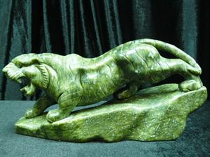 Green Jade Running Tiger: SIZE: LONG 12", DEEP 3", HIGH: 6.5". This jade tiger is made from one solid piece of jade. It appears dark gree. It is all hand carved. Very detailed.