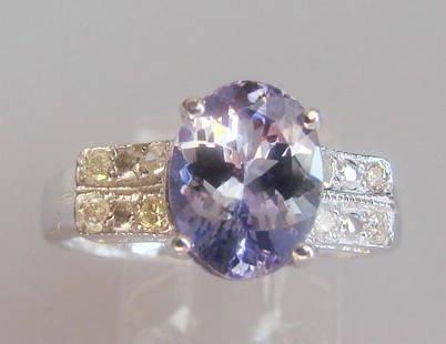 Tanzanite and Diamond Ring - Appraised at $12,470: Tanzanite: Weight: 1.73 carat, Clarity: AA+, Color: Violet Blue. Diamond: 8 Pieces, Weight: .24 carat, Clarity: SI2, Color: H, 14k w/g 2.30 grams. Size: 6.5