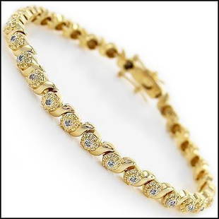 0.32 Cts Diamond 18KGP Designer Bracelet $1,810: 30 Single cut 1.2 mm round diamonds no treatment I2-I3 & J color.12.32 grams of brass layered with 18K yellow Gold.Length is 7 1/2 inches.The width is 1/4 inches.