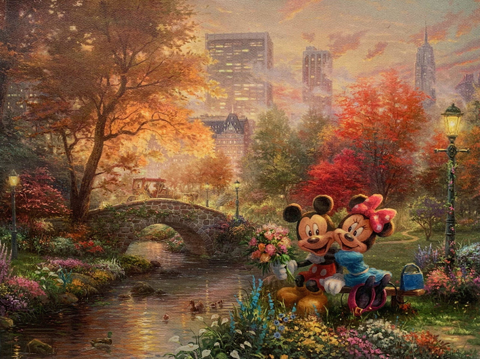 THOMAS KINKADE Disney Mickey & Minnie Mouse Central: This is a reproduction giclee on canvas by Thomas Kinkade titled “Mickey & Minnie Mouse in Central Park”Measures: 12? x 16?. Beautiful rich colors!Comes unframed, un-stretched. Excellent condition