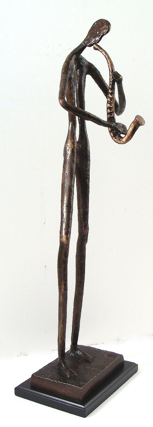 Antique Bronze Statue~Playing the Saxophone: This auction is for a good to excellent condition bronze figurine. Size: 12"x21" This will make a wonderful addition to a collection or special gift .