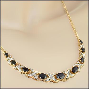 5.29 CT Sapphire & Diamond 18KGP Designer Necklace: 9 pieces of GENUINE Black Sapphires quality AAA no treatment.8 pieces of GENUINE 1.1mm faceted round diamond 0.06 carat Tw I-J color.10.48 grams of base metal layered with 18K yellow gold.The necklace