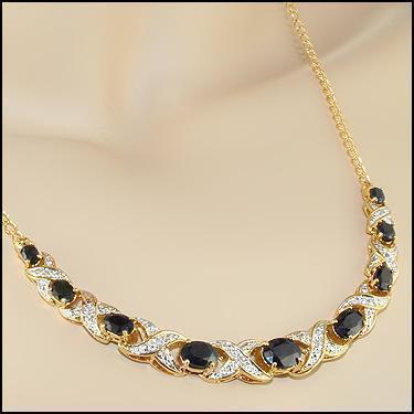5.29 CT Sapphire & Diamond 18KGP Designer Necklace: 9 pieces of GENUINE Black Sapphires quality AAA no treatment.8 pieces of GENUINE 1.1mm faceted round diamond 0.06 carat Tw I-J color.10.48 grams of base metal layered with 18K yellow gold.The necklace