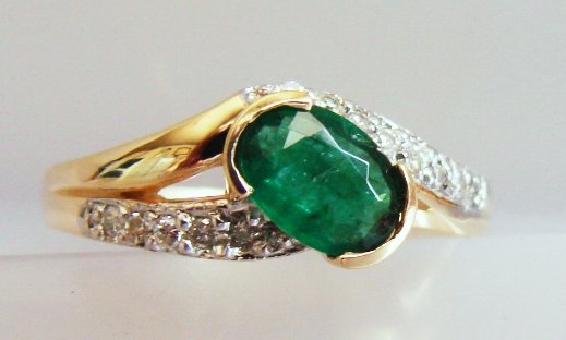 Emerald & Diamond Ring Appraised $7,425: Emerald and Diamond Ring Emerald Colombia, Weight: 1.65 carat, Clarity: SI 2, Color: Green, Diamond: 8 Pieces, Weight: .24 carat, Clarity: SI2, Color: H 14k w/g 2.30 grams Size: 6.5