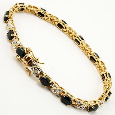 12.09 CT Sapphire & Diamond Designer Bracelet $1,350: 12 pieces of GENUINE 7X5mm oval black sapphires.12 pieces of GENUINE single cut diamonds, 0.09 carat tw.12.25 grams of brass layered with 18K yellow gold.The length is around 7 1/2 inches.The width is