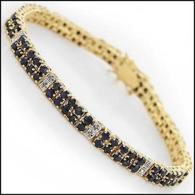 9.18 CT Black Sapphire & Diamond 18KGP Designer: 108 pieces of GENUINE 2.5 mm Round Black Sapphires quality AAA no treatment.6 pieces of GENUINE 1 mm faceted round diamonds no treatment.15.12 grams of brass layered with 18K yellow gold.The length is