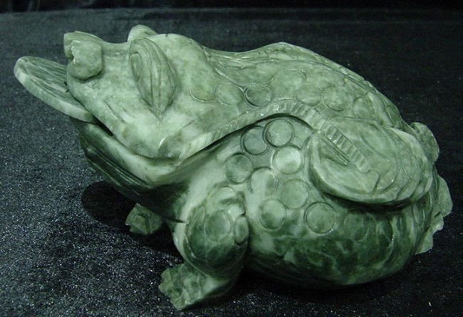 Hand Carved! REAL JADE LUCKY FROG W. COIN: This frog is made from one solid piece of jade. The coin is separate. It appears light green with some spots dark green. Very detailed carving. It is a fungshui item, which is believed to bring good l