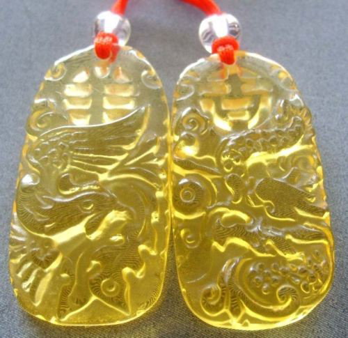 Yellow Cat Eye Pair of Love Dragon Phoenix Pendant: The Royal Cameo Carving Jade Charm was carved from a piece of fine grained Jade gemstone more than 200 years ago. The design is unique and very lovely and the carving is delicately performed. • •C