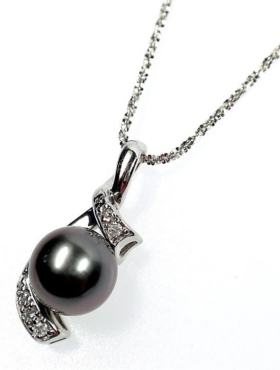 AIG Certified pearl and diamond pendant with chain: One black tahitian cultured pearl, 10mm in size Six bead set round brilliant cut diamonds, approx total weight of 6 stones = 0.06ct.