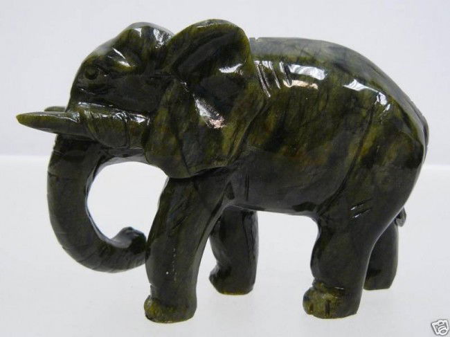 HAND CARVED NATURAL JADE ELEPHANT: This elephant is made of real jade. Dark green. Size: L: 5", W: 2", H: 3.5".