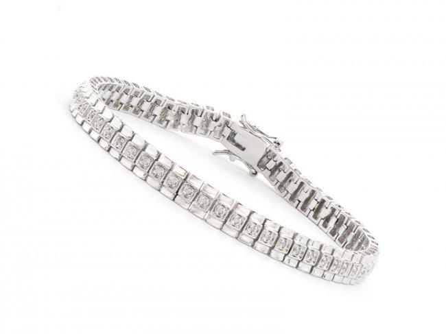 Plated Rhodium 0.58 ct Diamond Designer Bracelet $1,655: One Plated Rhodium 0.58ctw Diamond Bracelet. (58) round Diamonds with a color of I-J and clarity of I-3. Total weight of this bracelet is 14.75 grams. The length of this bracelet is 7 1/2 inches.