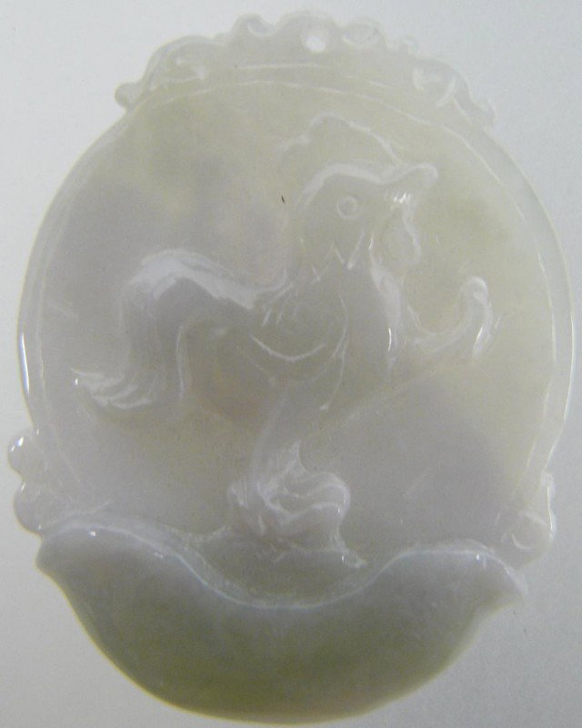 Hand Crafted Jade Rooster Pendant: This pendant is made from one solid piece of jadeite, which is hard and transparent. There is a hold on top of the pendant for you to put a string or necklace. Size: Wide: 1 3/4"(4.5cm). High: 2"(5cm)