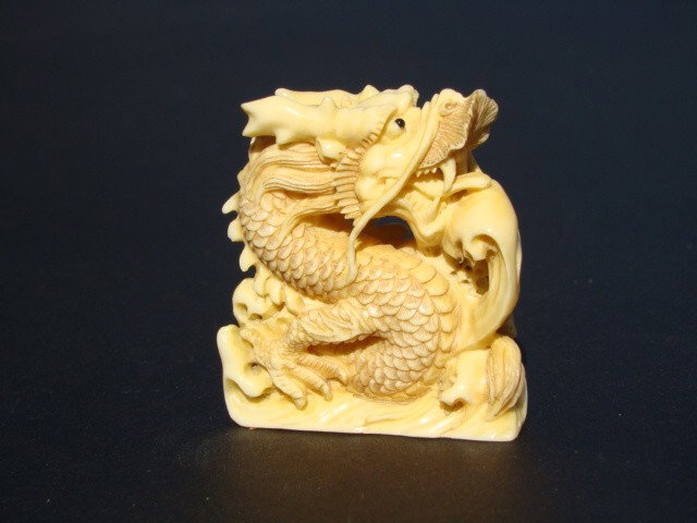 Rare Hand Carved Ivory Figurine Kylin Dragon: This beautiful art is all hand carved from natural Mammoth Ivory. This is a single dancing fairy. It is rare and unique. Size: Wide: 1.5 inch, High: 1.5 inch. About the Mammoth Ivory: Mammoth Ivory is