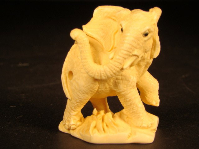 Rare Hand Carved Ivory Figurine Elephant Storm: This beautiful art is all hand carved from natural Mammoth Ivory. This is an intricate carving depicting an alpha male elephant striking a magnificant pose taken from chinese folklore. It is rare and 