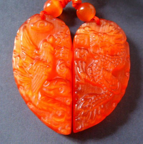 Red Cat Eye Dragon Phoenix Heart Pendant: The Royal Cameo Carving Jade Charm was carved from a piece of fine grained Jade gemstone more than 200 years ago. The design is unique and very lovely and the carving is delicately performed. • •C