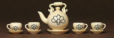 Mammoth Tusk Netsuke Miniature Antique Tea Set Carving: "100% Genuine Mammoth ivory Miniature Chinese Antique Tea Set Carving.There are flower scrimshaw on the surface of the Tea pot and each tea cup. This symbol always can be found on the surfacE Chinese
