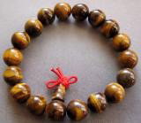 Tiger Eye Beads Tibetan Buddhist Prayer Mala Brace: This is a set of wooden prayer beads. They are normally used for both prayer and meditation. This set of Tibetan prayer beads was handmade. There are 15 prayer beads on this strand.
