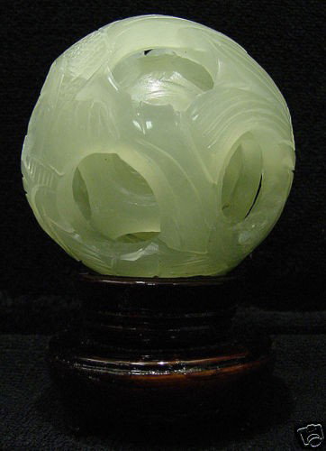 SOLID JADE 5 LAYER PUZZLE BALL: THIS WONDERFUL PIECE OF WORK IS MADE OF REAL JADE. IN ONE PIECE OF SOLID JADE, WE CARVED IN A FEW LAYERS AND IT IS CARVED FROM INSIDE OUT. THE MOST INTERESTING PART OF THIS ITEM IS THAT ALL THE BALLS 