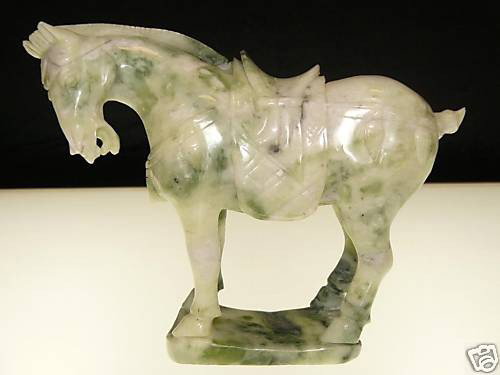Rare Hand Carved Saddled Jade Tang Horse: This horse is made from one piece solid Taiwan jade. It appears light green with some area dark green. It comes with a wooden base. Size: L: 8", W: 3", H: 8" The Royal Cameo Carving Jade Charm was car