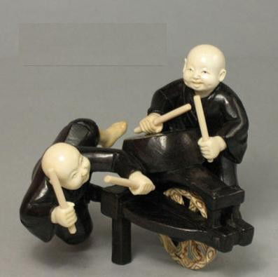 Mammoth Ivory & Ebony Wood "Happy Boy Playing Drum": 100% Genuine Mammoth ivory & Ebony Iron Wood handcrafted "Happy Boy Playing Drum" okimono carving, size: 3-1/4" x 2-5/8" x 2-3/4" (83mm x 67mm x 70mm). This okimono is carved by our artisan. The carvi