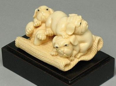 Handcrafted Mammoth Ivory Figurine Cute Pug Dogs: 100% Genuine Mammoth ivory handcrafted "Three Cute Pug Dog" carving, size: 2-1/8" x 1-11/16" x 1-7/16" (54mm x 43mm x 37mm). This carving is carved from the mammoth ivory tusk with in top quality with