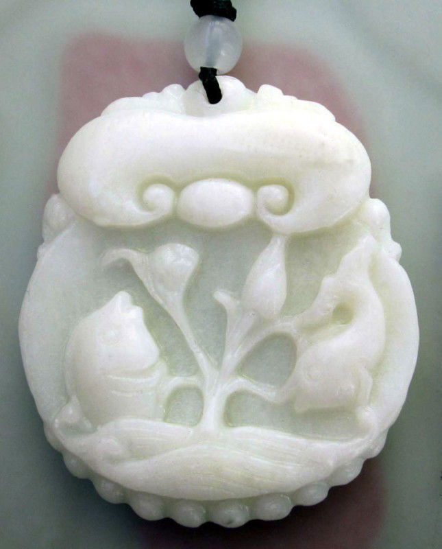 White Green Jade Auspicious Fishes Pendant: The Royal Cameo Carving Jade Charm was carved from a piece of fine grained Jade gemstone more than 200 years ago. The design is unique and very lovely and the carving is delicately performed. Size: 32