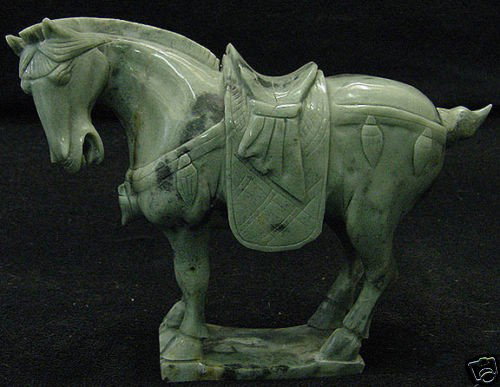 Rare Hand Carved Saddled Jade Tang Horse: This horse is made from one piece solid Taiwan jade. It appears light green with some area dark green. It comes with a wooden base. Size: L: 7", W: 3", H: 6" The Royal Cameo Carving Jade Charm was car