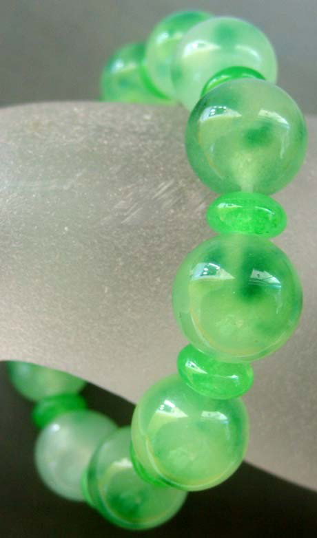 Green Jade Beads Elastic Bracelet: Size : 75mm x 12mm It is the customary and traditional belief of Chinese people that wearing the jade is the good means of which people will be protected from bad luck, evil spirit and danger. Jade or