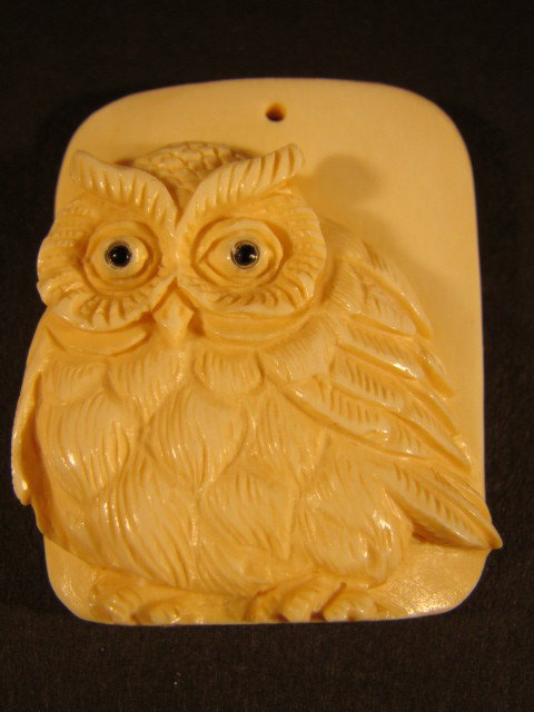 Rare Hand Carved Mammoth Ivory "Midnight Owl": 100% Genuine Mammoth ivory handcrafted "Midnight Owl" netsuke scrimshaw carving, size: 2 inch by 1 inch. This carving is carved by our artisan from a piece of material with mammoth ivory bark at the b