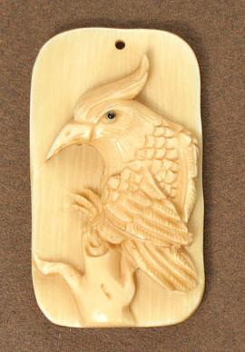 Rare and Unique Mammoth Ivory Bird Carving Pendant: 100% Genuine Mammoth Ivory handcrafted Bird, size: 1-11/16" x 15/16" (43mm x 24mm). This pendant is carved from a material in natural ivory color. Our designer used this special feature of the materia