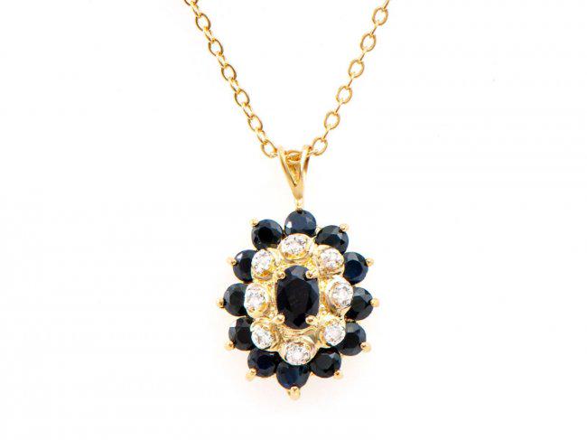 2.63 Ct Black Sapphire & Diamond Designer Necklace $995: One Plated 18KT Yellow Gold 2.60ctw Black Sapphire and Diamond Pendant with Chain. (1) center black Sapphire measuring 6x4mm. (12) black Sapphires measuring 3.1mm. (8) round diamonds measuring 1.1mm. 