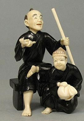 Mammoth Ivory & Ebony Iron Wood "Old Man & Kid" Okimono: 100% Genuine Mammoth ivory & Ebony Irone Wood handcrafted "Old Man & Kid" okimono, size: 2-1/2" x 1-3/8" x 1-5/8" (64mm x 35mm x 42mm). This okimono is carved by our artisan. The carving is very detai