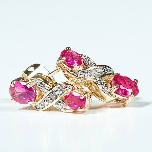 Genuine 2 CT Ruby Diamond Earrings: Master Jewelers designed your earrings with 2 pcs. 4x3mm rubies, 2 pcs. 2x1.5mm rubies. set in fine 925 sterling silver and layered with 18K Gold. The height is 3/4inches or 19mm and the width is1/4in