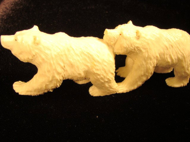 Hand Crafted Mammoth Ivory Figurine Polar Bears: This beautiful art is all hand carved from natural Mammoth Ivory. A carving of 2 Polar Bears wandering together. It is rare and unique. Size: Wide: 1.5 inch, Length: 5 inch, High: 2 inch. About the Ma