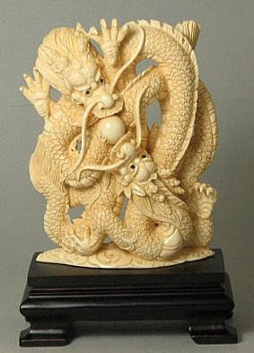Mammoth Ivory "Double Dragon With Ball" Carving: 100% Genuine Mammoth ivory handcrafted "Double Dragon Wiith Ball" carving. size: 3-3/4" x 2-3/4" x 3/4" (95mm x 70mm x 19mm). .This carving is carved from the mammoth ivory tusk with in top quality wi
