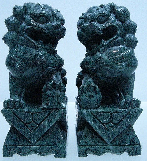 PAIR OF 8" GREEN JADE FUDOG / FOODOG / LION : This pair of foodogs is made from one solid piece of jade. Foodog is the ancient lion. They come in a pair, a male and female. The male is stepping on a ball and the female is stepping on a little lio