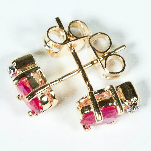 Genuine .85 CT Ruby Diamond Post Earrings : Master jewelers designed your earrings with 2 pieces of GENUINE 6X4mm faceted oval rubies. 2 pieces of GENUINE single cut diamonds .03 carat tw. 1.3 grams of sterling silver layered with 18K Gold. The