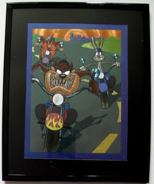 TAZ YOSEMITE SAM BUGS MOTORCYCLE Framed Foil Art: This is a Warner Bros Looney Tunes Framed Foil Art. This fantastic animation features Yosemite Sam, Taz, & Bugs Bunny riding motorcycles as they appeared in the 1970's cartoons. This beautifully frame