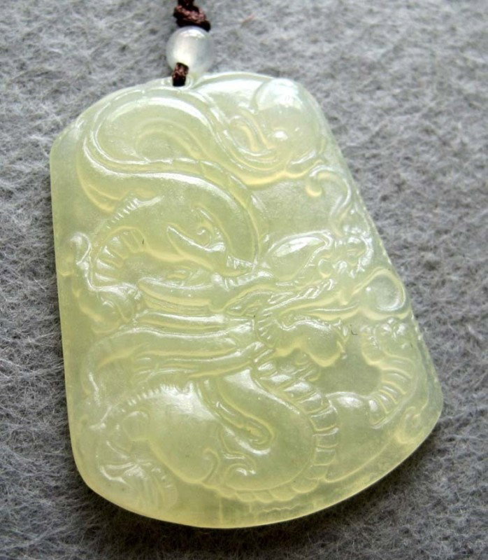 Green Jade Super Power Dragon Amulet Pendant: The Royal Cameo Carving Jade Charm was carved from a piece of fine grained Jade gemstone more than 200 years ago. The design is unique and very lovely and the carving is delicately performed. Size: 27