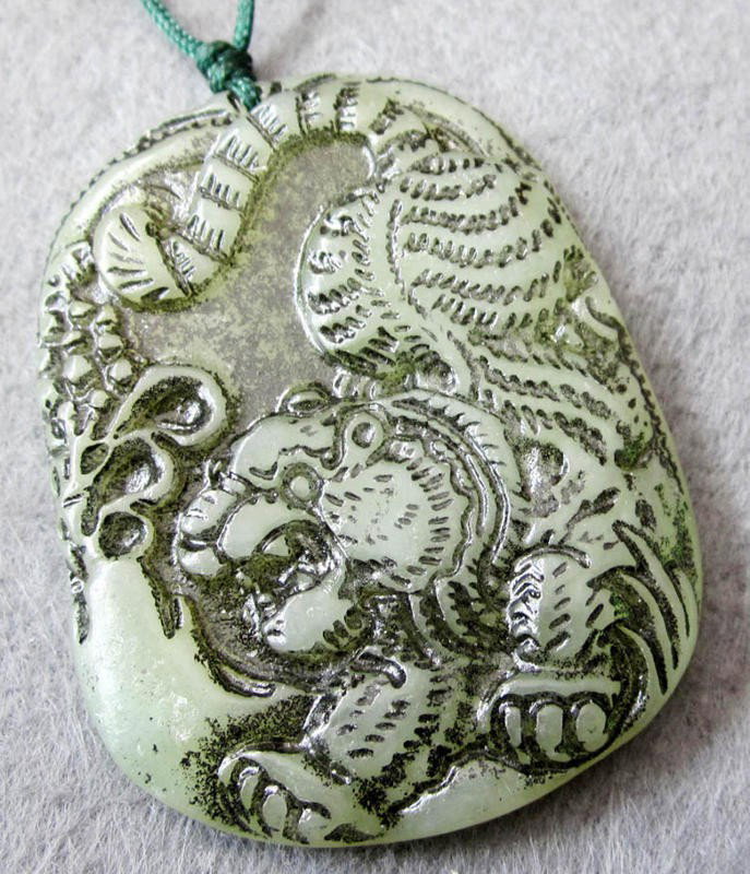 Antique Jade Chinese Zodiac Tiger Amulet Pendant: The Royal Cameo Carving Jade Charm was carved from a piece of fine grained Jade gemstone more than 200 years ago. The design is unique and very lovely and the carving is delicately performed. Size: 25