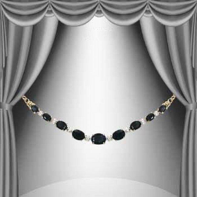 8.05 Cts Black Sapphire & Diamond 18KGP Designer: 9 pieces of GENUINE 8x4mm ovals Black Sapphires quality AAA no treatment.2 pieces of GENUINE single cut diamonds 0.02 carat Tw.8.65 grams of brass layered with 18K yellow Gold .The length is around 18