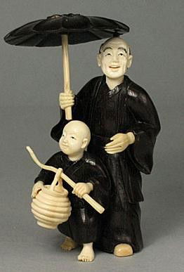 Mammoth Ivory & Ebony Iron Wood "Father & Son" Oki: 100% Genuine Mammoth ivory & Ebony Iron Wood handcrafted "Father & Son" okimono, size: 3-1/2" x 1-5/8" x 1-3/8" (89mm x 41mm x 35mm). This okimono is carved by our artisan. The carving is very detail