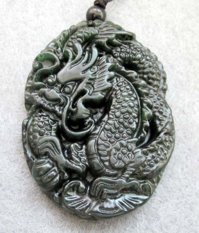 Black Green Jade Super Power Dragon Amulet Pendant: The Royal Cameo Carving Jade Charm was carved from a piece of fine grained Jade gemstone more than 200 years ago. The design is unique and very lovely and the carving is delicately performed. Size: 25