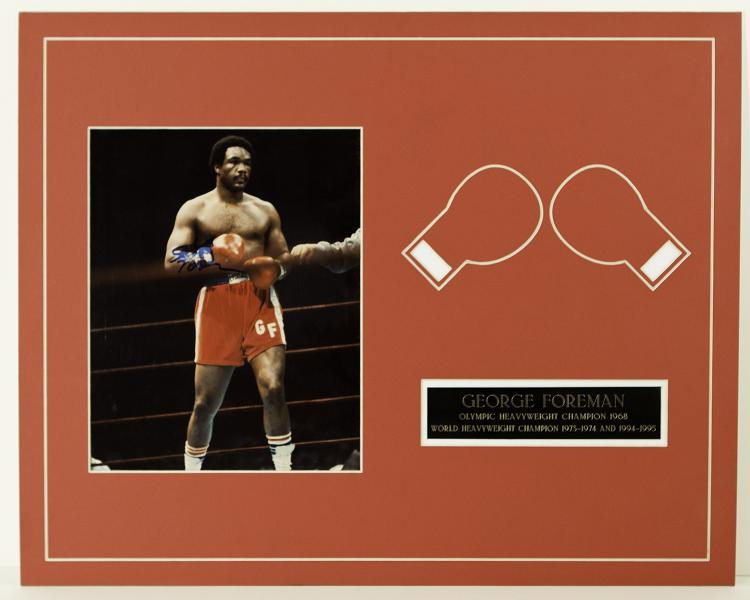 George Foreman autographed framed collage: This piece comes with an autographed matted cut which has been personally hand signed by George Foreman. This also comes with an 8x10 photo and a Pate.