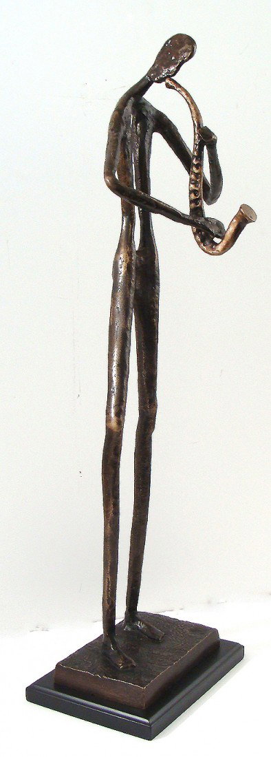 Antique Bronze Statue~Playing the Saxophone: This auction is for a good to excellent condition bronze figurine. Size: 12"x21" This will make a wonderful addition to a collection or special gift .