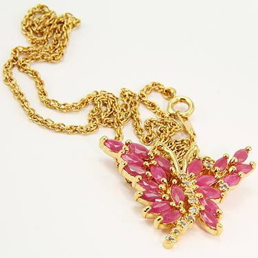 3 CT Cabochon Ruby Diamond Butterfly Pendant: Master jewelers designed your pendant with 20 pieces of GENUINE 5X2.5mm faceted Cabochon rubies. 11 pieces of GENUINE single cut diamonds. .08 carat tw. 4.3 grams of sterling silver layered with 18K G